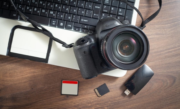 Modern DSLR camera and laptop computer