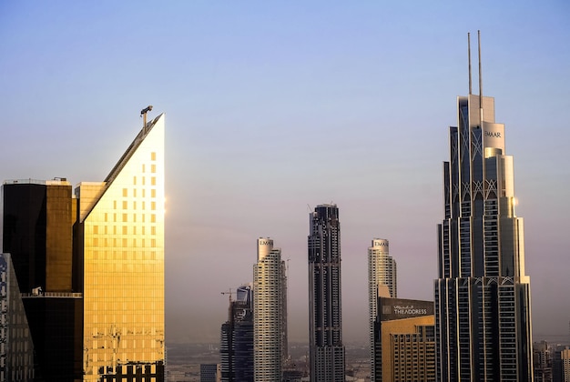 Modern Dubai skyline after the sunset with beautiful light and Burj Khalifa