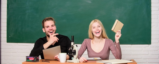 Modern education Having fun in college Carefree students Enjoying time in college Guy and girl sit classroom Studying in college or university Friends students studying university College fun