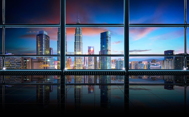 Modern empty and clean office interior with glass windows Kuala Lumpur city skyline background early morning scene