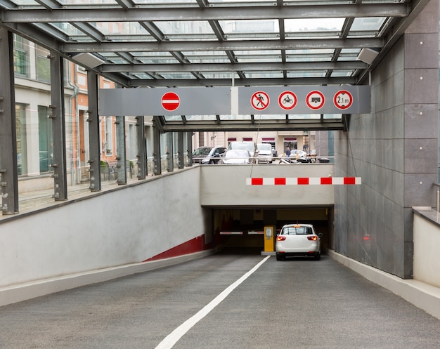 Modern entrance to the underground parking, old European town.