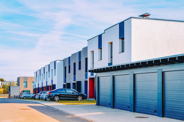 Modern EU residential apartment house building with garage and parking boxes concept.