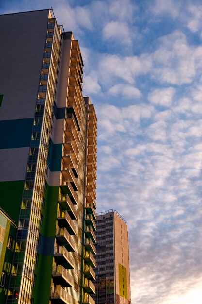 The modern facade of the office building is an abstract fragment, with shiny Windows in a steel structure. Great background for a business card, flyer, banner with space for an inscription or logo