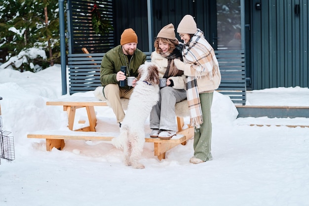 Modern family spending time outdoors on winter day