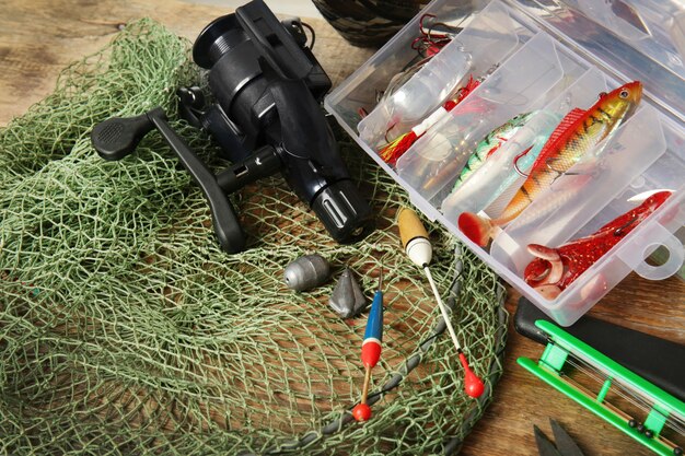 Photo modern fishing equipment on table