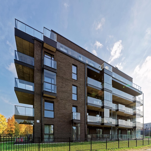 Modern glass architecture of apartment residential building. And outdoor facilities.