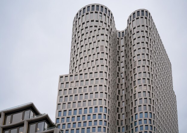 Modern glass skyscraper as residential apartment house or office building architecture in Berlin, capital of Germany. German flat and home, in real estate.