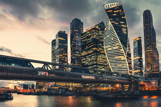 Modern glass skyscrapers with night city lights Moscow Russia