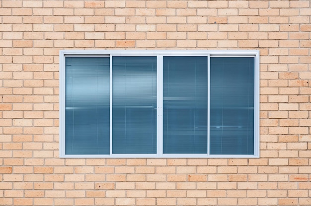 Modern glass window on the brick wallblanket window frame