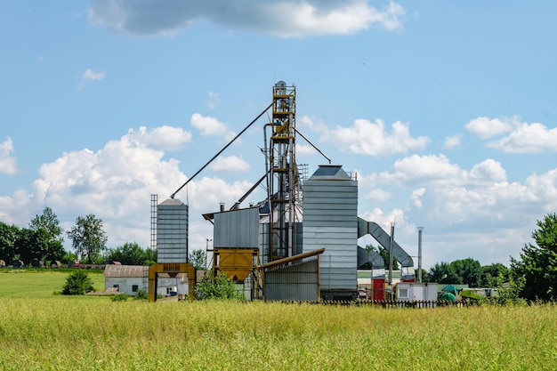 Modern Granary elevator Silver silos on agroprocessing and manufacturing plant for processing drying cleaning and storage of agricultural products flour cereals and grain