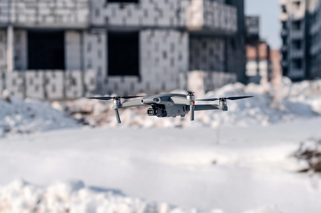 Modern gray drone on construction site Blurred background Modern technologies in construction