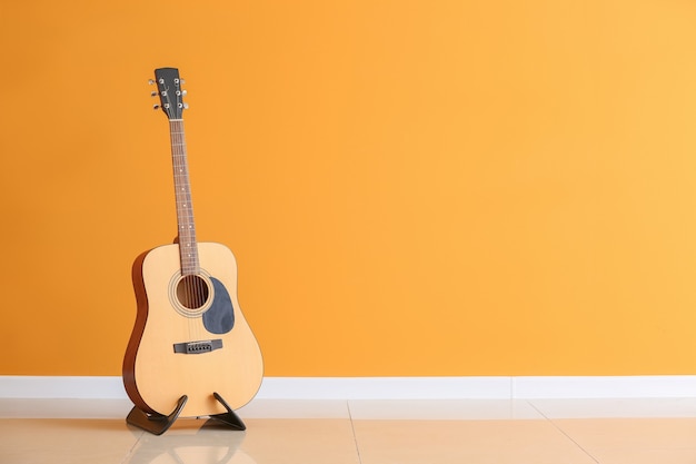 Modern guitar near color wall