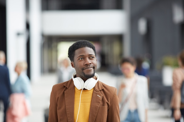 Modern guy in crowded lobby