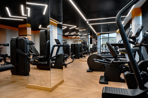 Modern gym interior with new fitness equipment