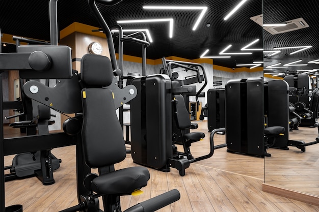 Modern gym interior with new fitness equipment