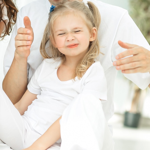 Modern happy family on a Sunday in the nursery .the concept of parenthood