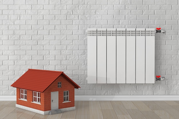 Photo modern heating radiator with home in front of brick wall