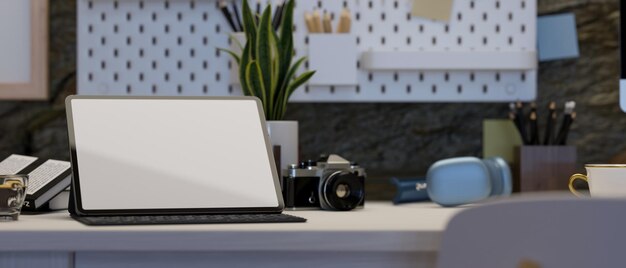 Modern hipster working desk with tablet mockup camera headphones and accessories on white table