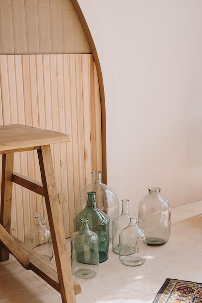 Modern home interior decorated with transparent bottles