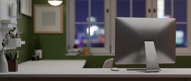 Современное домашнее рабочее место с компьютером и местом для копирования на зеленой стене с белой столешницей