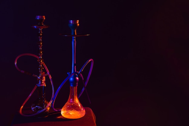 Modern hookah, shisha on a black background