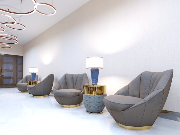 A modern hotel with a reception area and lounge with large upholstered designer chairs and a large chandelier of golden rings. 3d rendering.