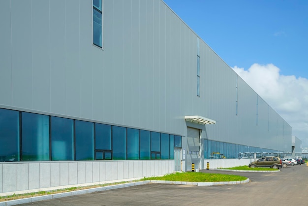 modern industrial warehouse exterior under blue sky