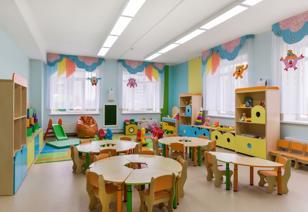 Photo modern interior of playroom in kindergarten. preschool education.