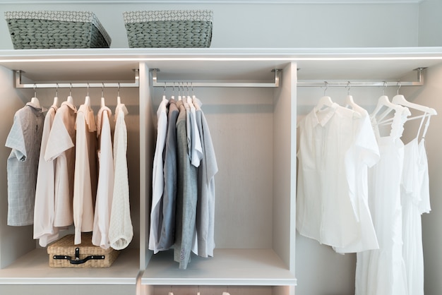 Photo modern interior wardrobe with shirt and dress in shelf.