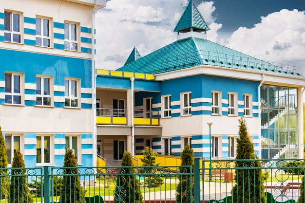 A modern kindergarten or school in a new area of the city\
social security of the people caring for families buildings for\
education in new districts education of children in modern\
conditions