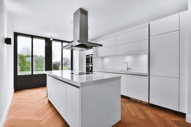 Modern kitchen design with white kitchen set and parquet floor