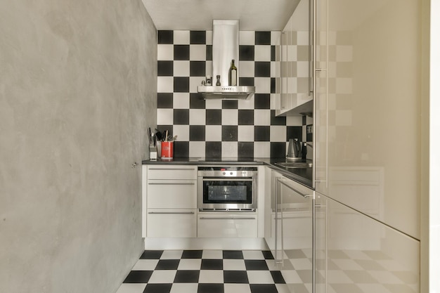 Modern kitchen near dining room in flat