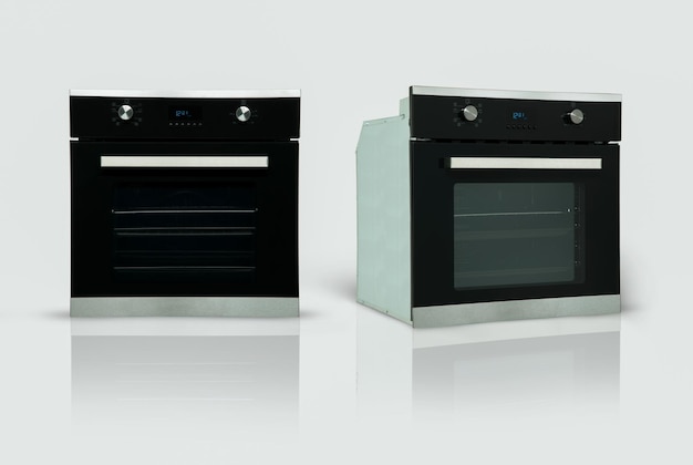 A modern kitchen oven in two positions on a white background kitchen appliances Isolated