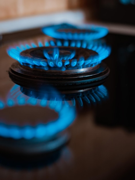 Modern kitchen stove cook with blue flames burning