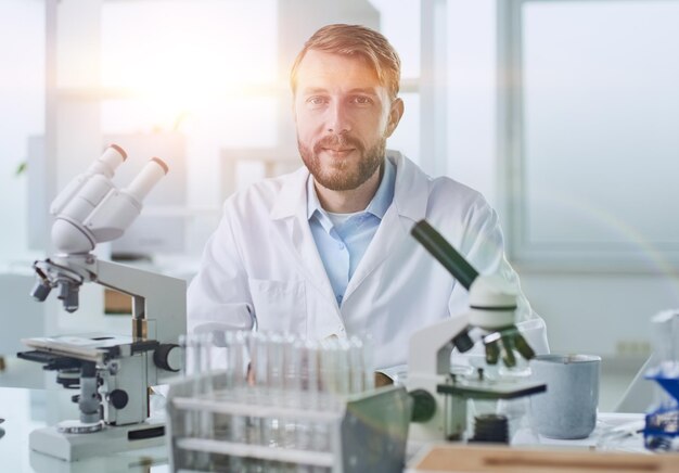 in a modern laboratory research scientist conducts experiments