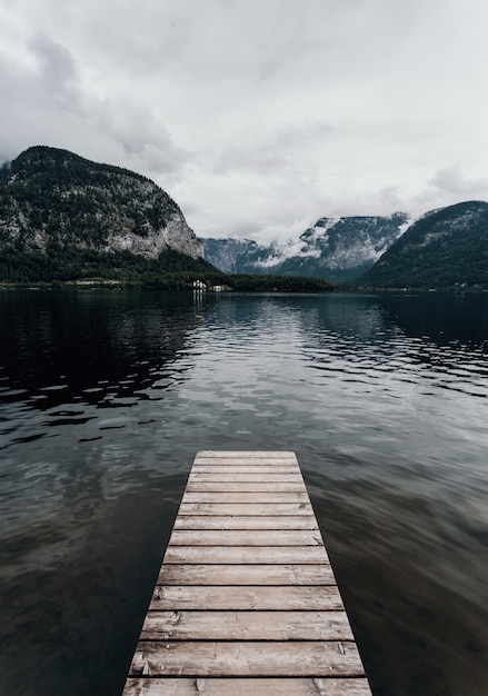 Modern landscape shot of Hallstatt in Austria Lake Hallstatt foggy dramatic mood cloudy travel