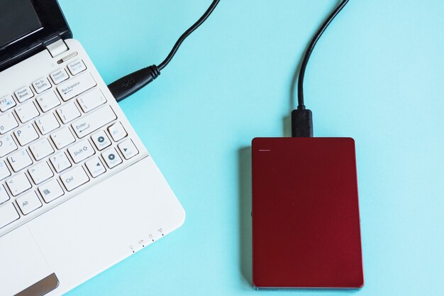 Modern laptop keyboard and storage external hard drive.