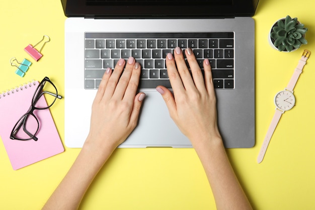 Modern laptop and stationery on the table top view