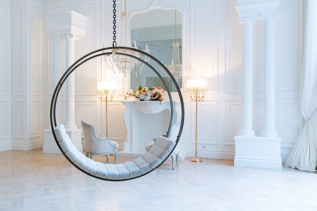 Modern light clean rich baroque style interior with swing