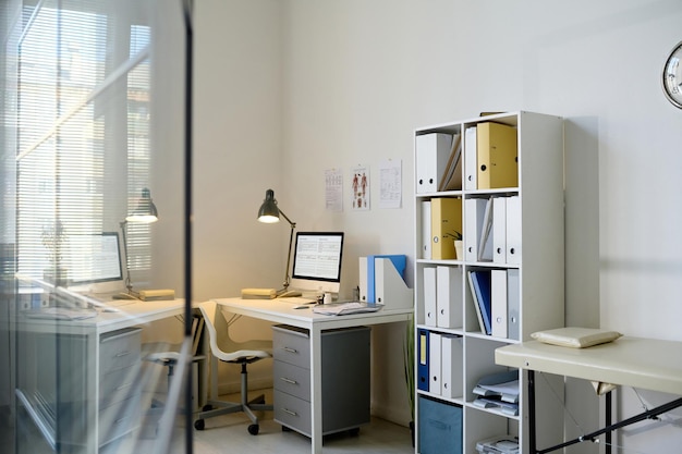 Modern light office of doctor with workplace in clinic