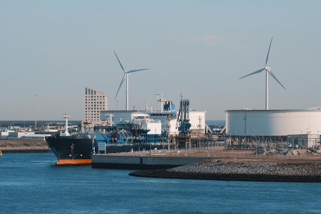 Modern LNG tanker for bunkering LNG vessel during cargo operations in the European port Natural ga