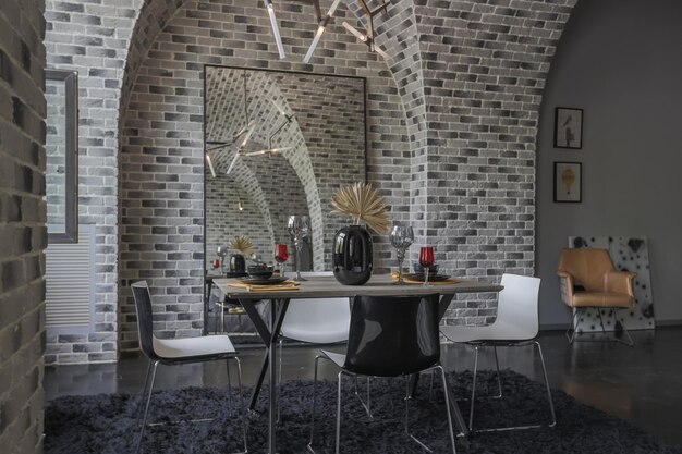 Modern luxury design of a brutal apartment interior with arches in the style of a medieval castle with bright accents free layout kitchen area seating and eating area