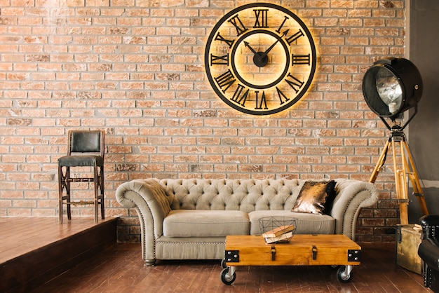 Photo modern luxury living room with stone wall, sofa with clock, interior