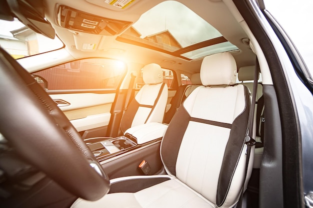 Modern luxury prestige car interior dashboard steering wheel Orange red car interior