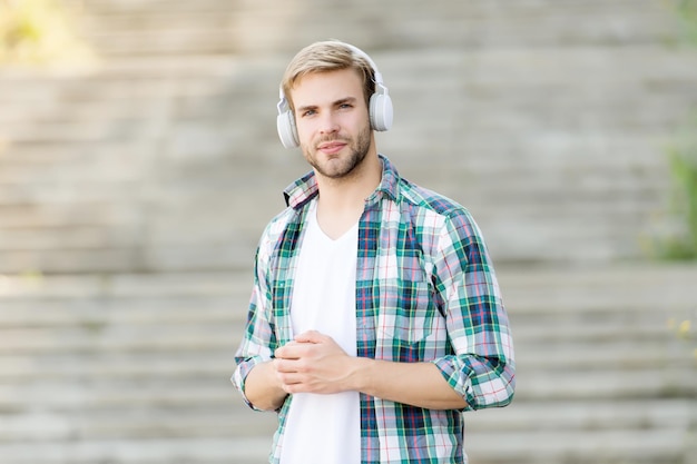 Modern man listening music wireless headphones musical style concept