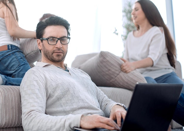 Modern man work on a laptop at his homepeople and technology