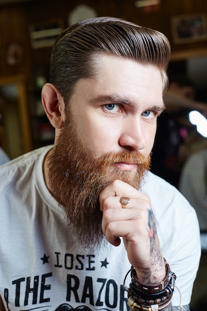 Modern men hipster haircut, perfect hairstyle for men with long hair.