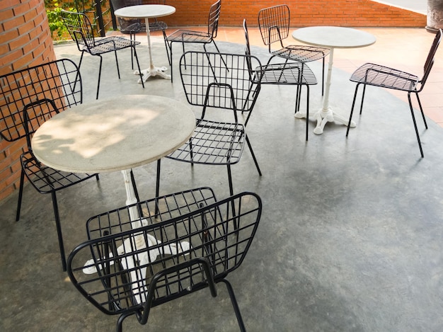 The modern metal chair with the small white table