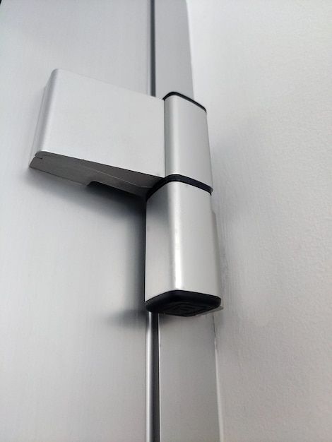Modern metal door hinge with matte finish closeup