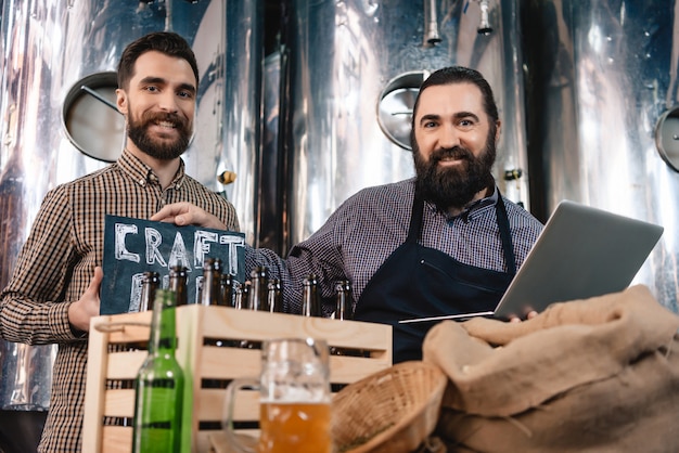 Photo modern microbrewery workers craft beer production.